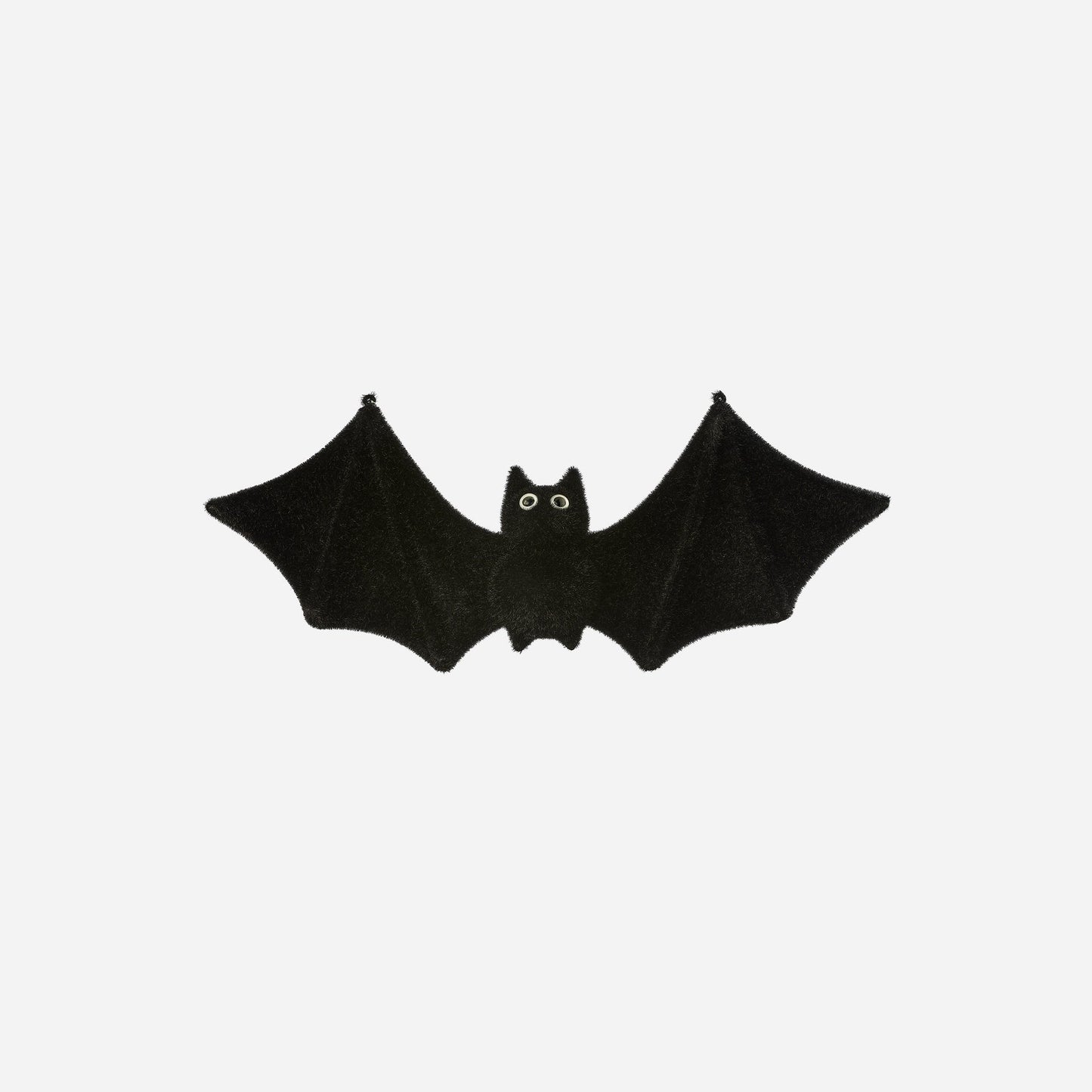 Black bat-shaped toy on a white background