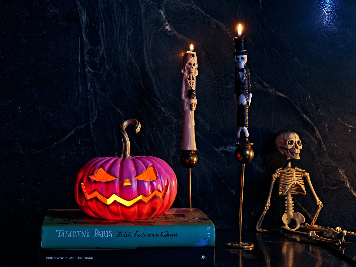 lit jack o lantern pink and orange with taper candles