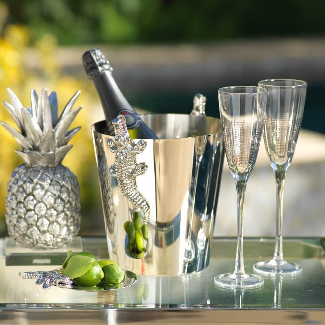 Crocodile Collection of stylish home products featuring a silver champagne bucket and elegant glasses.