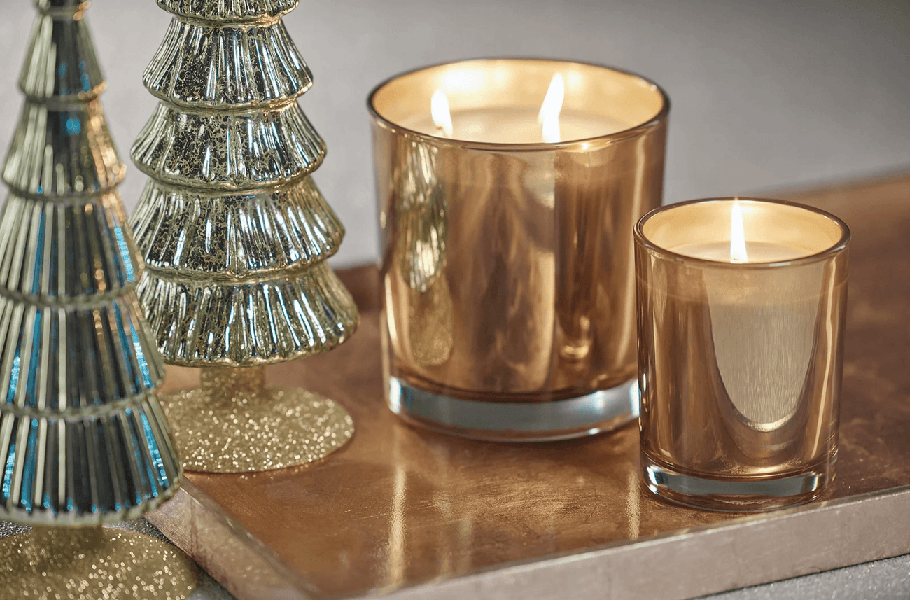 Holiday Home Fragrance collection featuring elegant candles and festive decor.