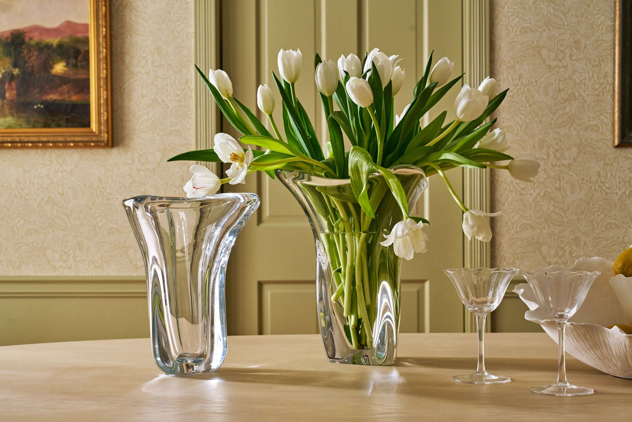 Stylish Vases, Pots, and Planters featuring elegant glass vases with white tulips on a wooden table.