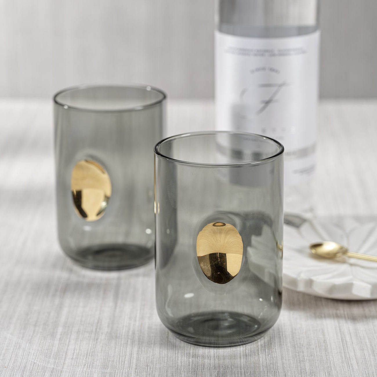 Elegant gray tumblers with gold accents, perfect for stylish gatherings. Enhance your collection of Tumblers.
