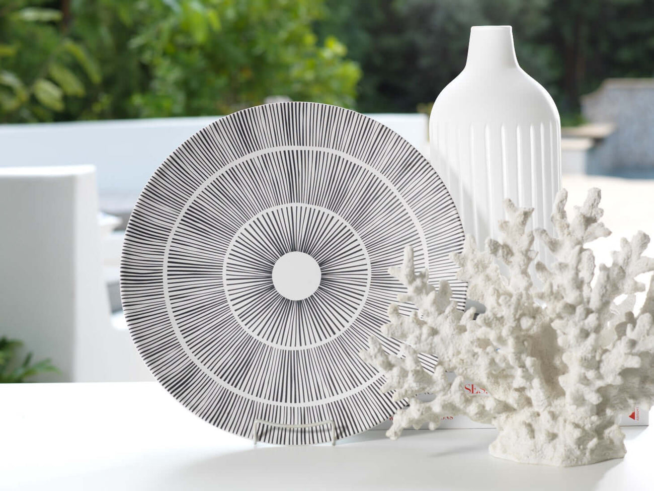 Stylish decor items including a plate, vase, and coral perfect for Mother's Day Picks.