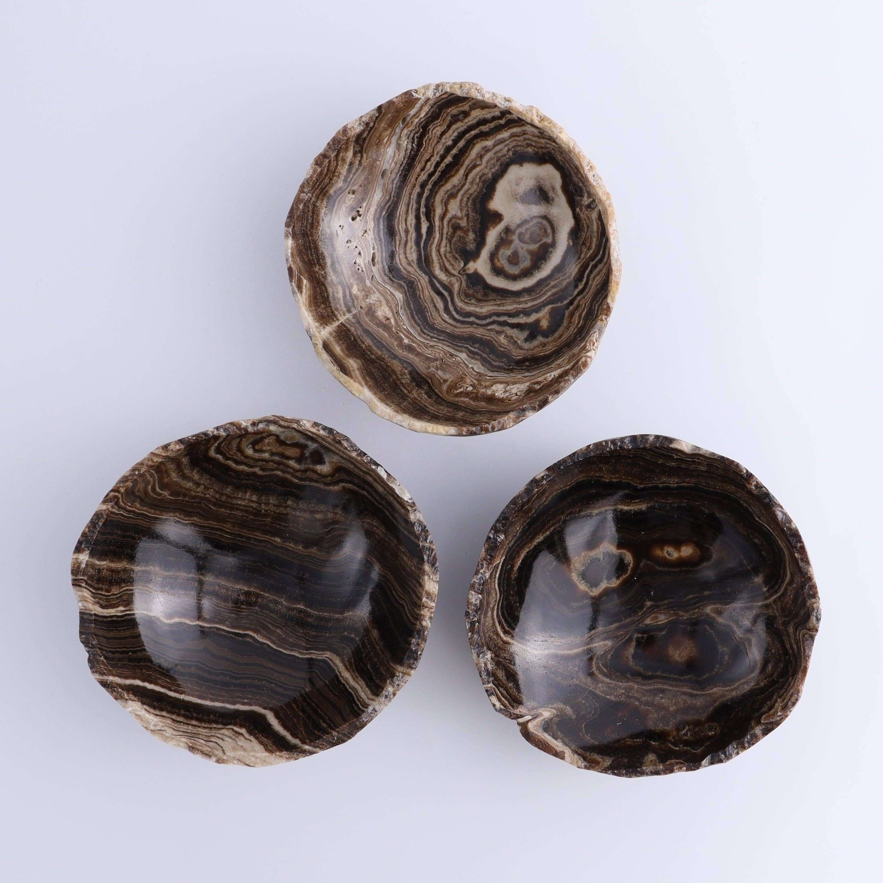 Mexican Onyx/Calcite Bowl OOAK displayed in a set of three unique, artisanal stone bowls showcasing natural patterns.