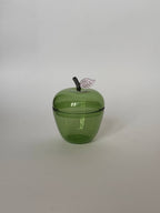 La Pomme, Green glass apple container with a removable lid and a metallic leaf detail.
