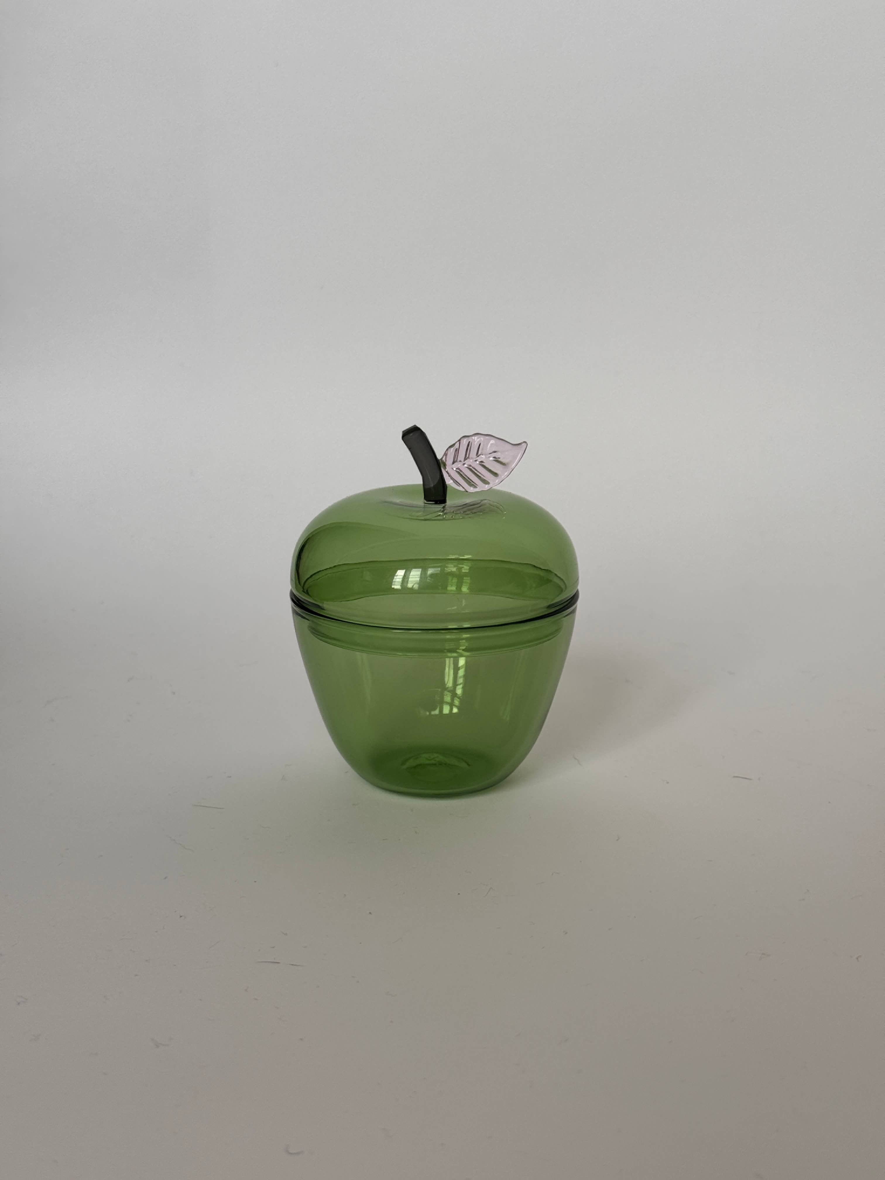 La Pomme, Green glass apple container with a removable lid and a metallic leaf detail.