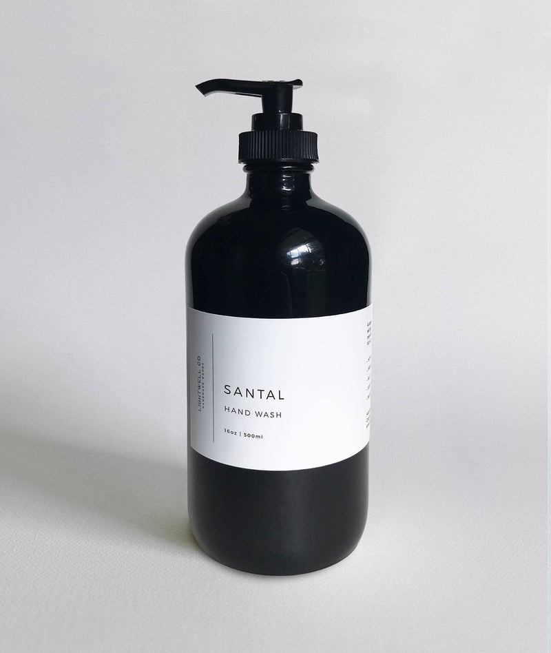 Santal Hand Wash in a black glass bottle with a pump, 16oz/500ml, featuring cedar and sandalwood notes.