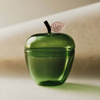 La Pomme, Green apple-shaped jar with a gilded leaf, crafted in rich forest green glass.