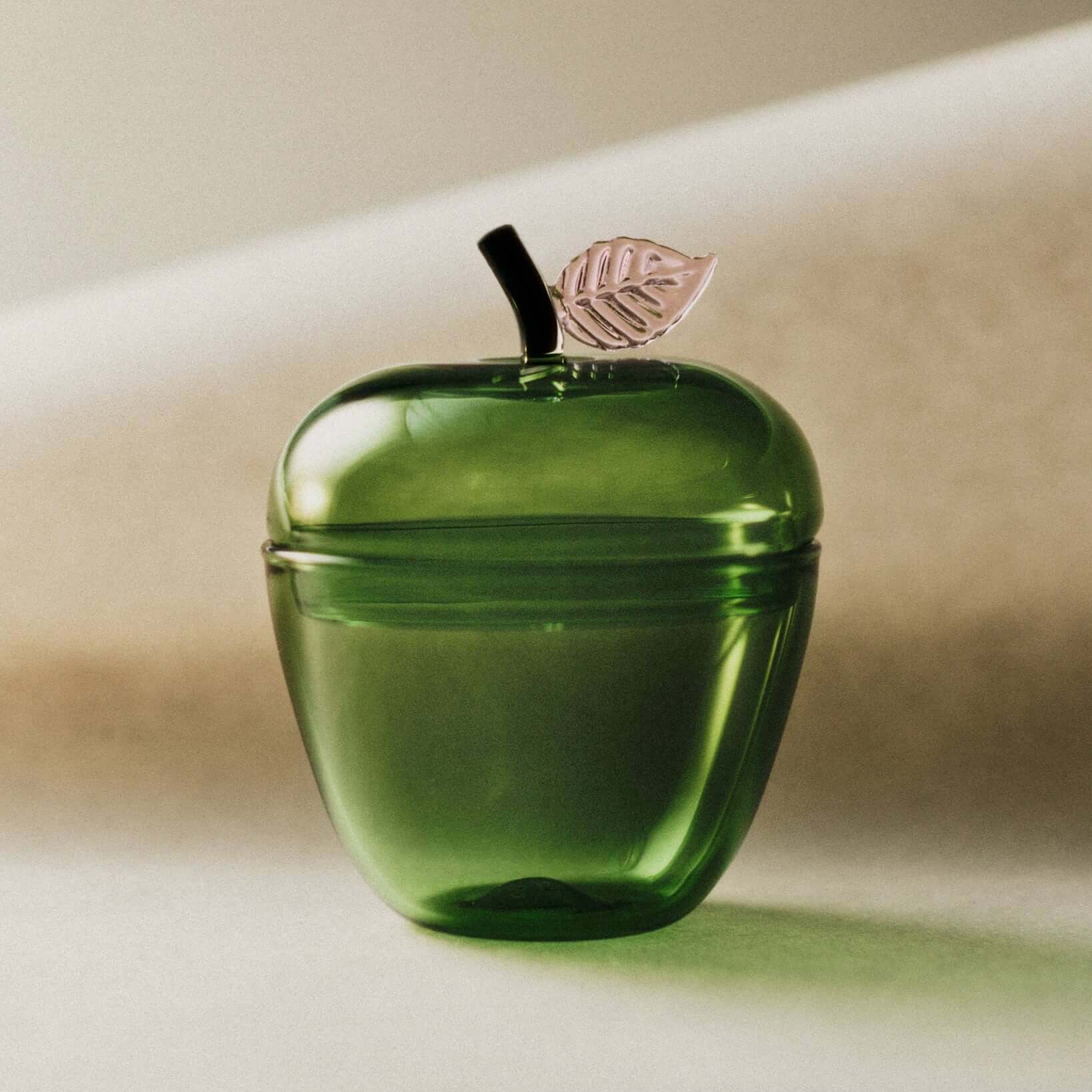La Pomme, Green apple-shaped jar with a gilded leaf, crafted in rich forest green glass.