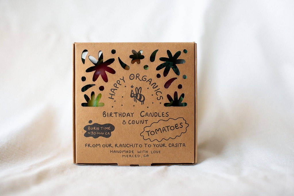 Cherry Tomato Beeswax Birthday Candles 8-count beautifully packaged with artistic floral cutouts.