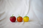 Cherry Tomato Beeswax Birthday Candles 8-count in vibrant red, orange, and yellow shapes.