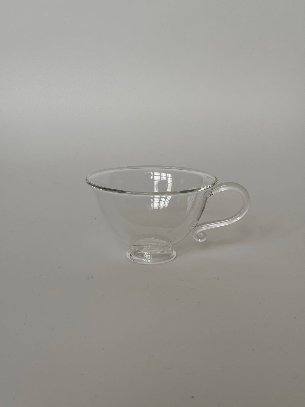 Image of a Petite Tasse, Clear (Set of 2), showcasing its elegant design and curvy silhouette.