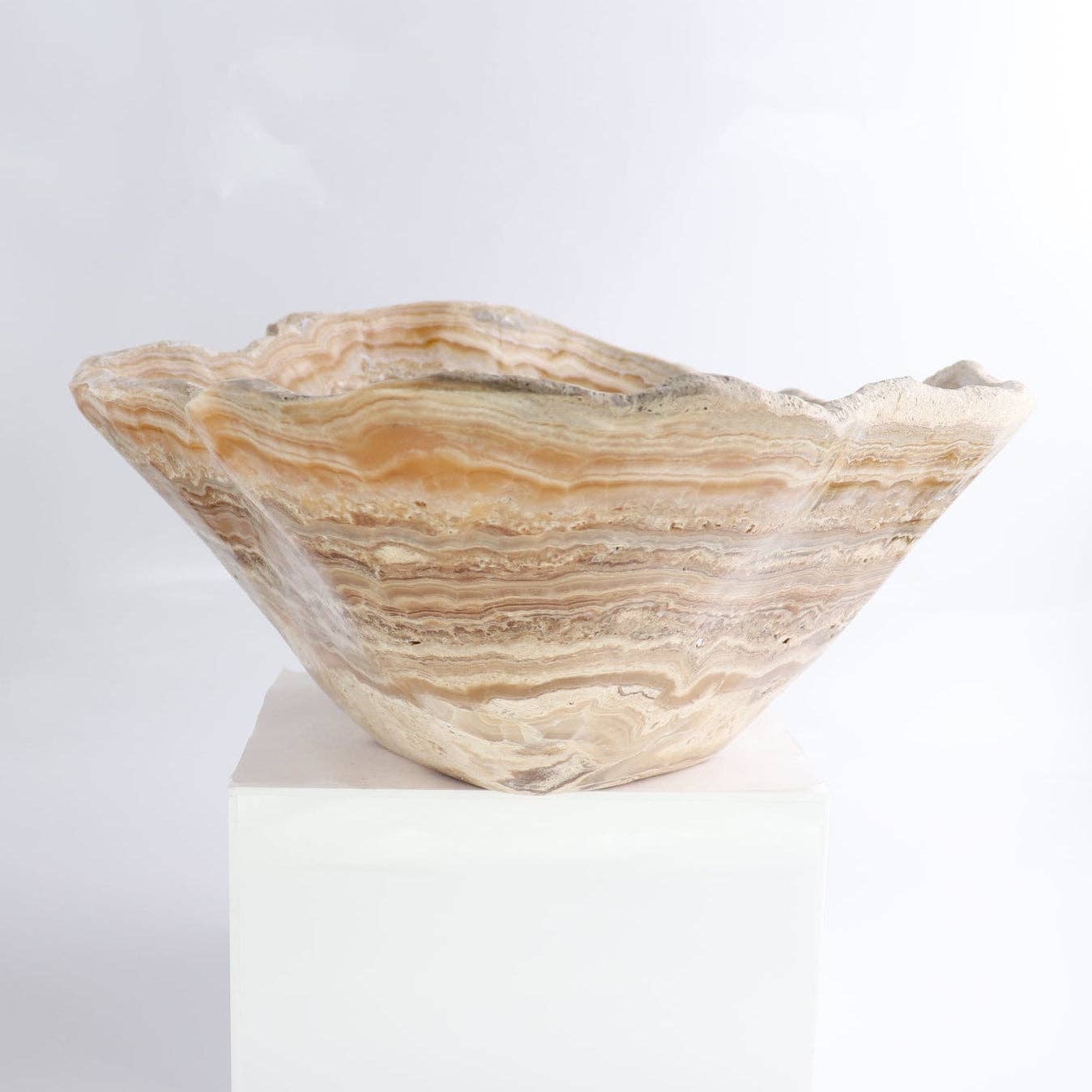 Mexican Onyx/Calcite Bowl 16" showcasing rich amber and honey-toned banding in a unique hand-carved design.