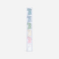 Set of pastel-colored plush toys in a clear holder on a white background
