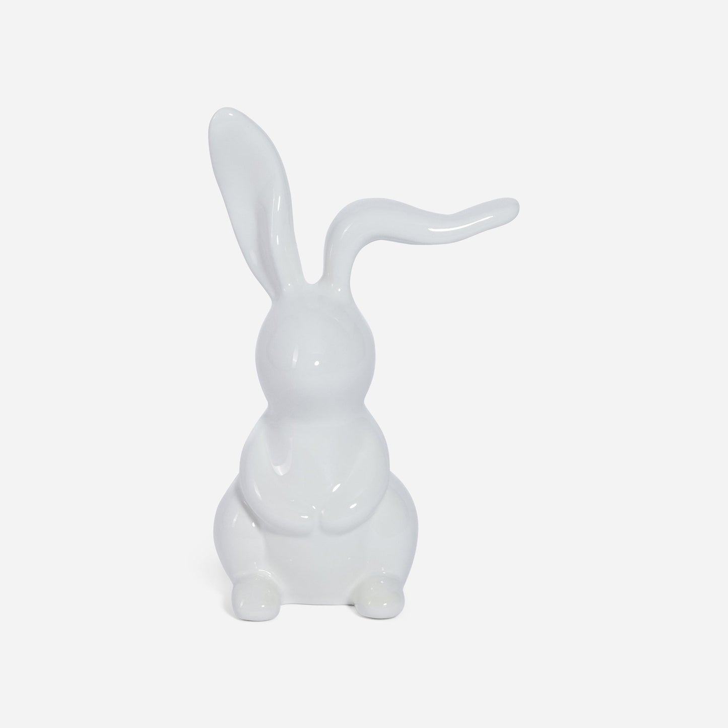 White ceramic rabbit sculpture on a light gray background