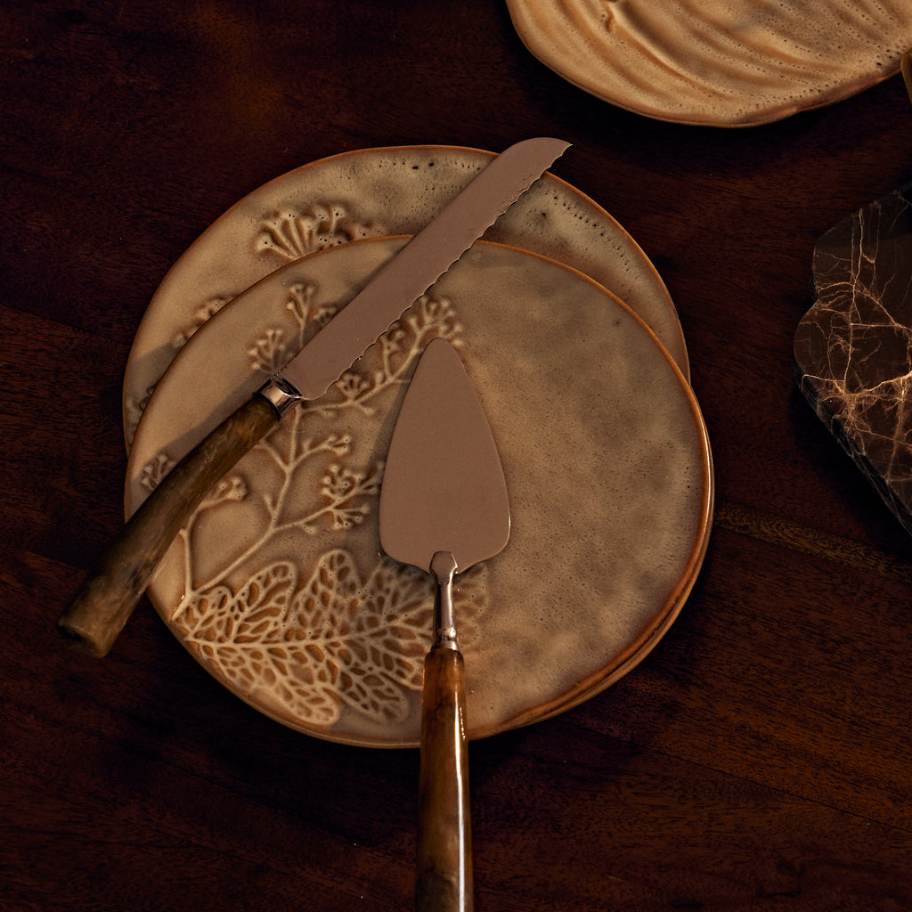 plates with knives on top