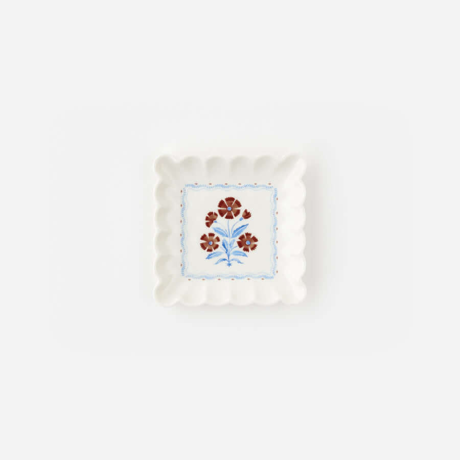 Jardin Floral Porcelain Plate - Set of 2, scalloped-edge plate with red carnations and blue stems.