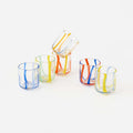 Terrazzo Striped Drinking Glass - Set of 6 Assorted showcasing colorful striped tumblers stacked together.