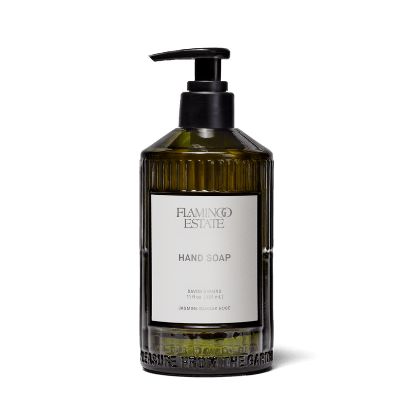 Jasmine Damask Rose Glass Hand Soap in a translucent green glass pump bottle by Flamingo Estate.