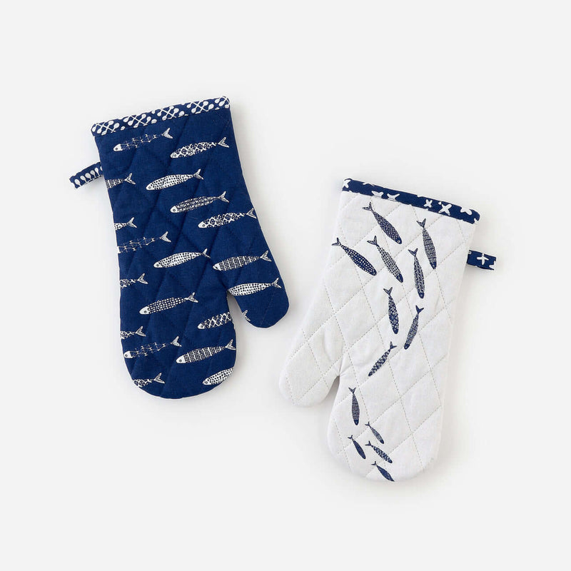 Set of two assorted fish-themed quilted oven mitts for cooking and baking.
