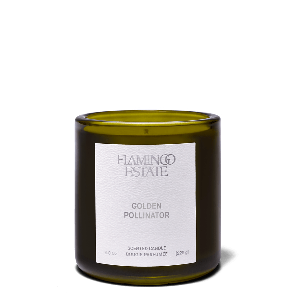 Golden Pollinator Candle in an elegant green jar, exuding a warm, honeyed scent reminiscent of summer blooms.