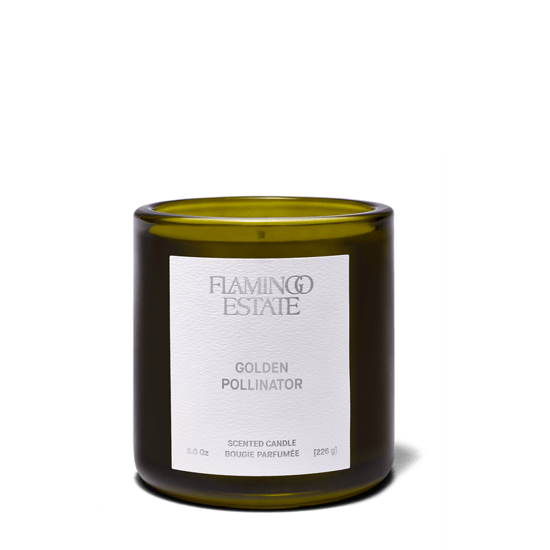 Golden Pollinator Candle in an elegant green jar, exuding a warm, honeyed scent reminiscent of summer blooms.