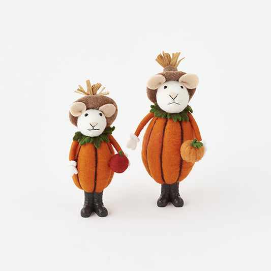 Two plush toys resembling mice in pumpkin costumes on a white background