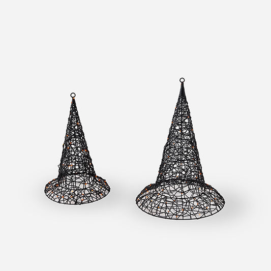 Two black wire mesh cone-shaped objects on a white background