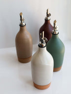 Tall Handmade Ceramic Oil Bottle collection in various matte glazes with polished pourers.