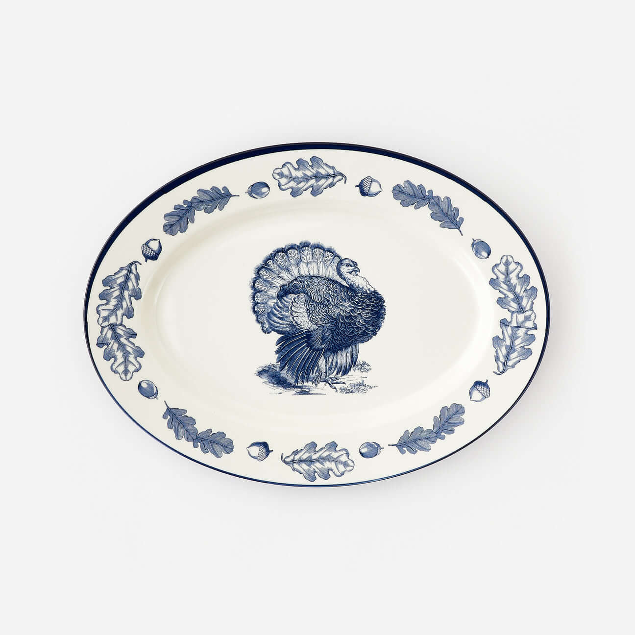Turkey "Enamel" Oval Platter featuring a detailed turkey design with oak leaves on a classic blue-and-white background.