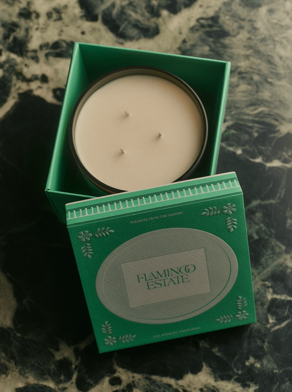 Heirloom Tomato Candle - 3-Wick in a green box on a marble surface.