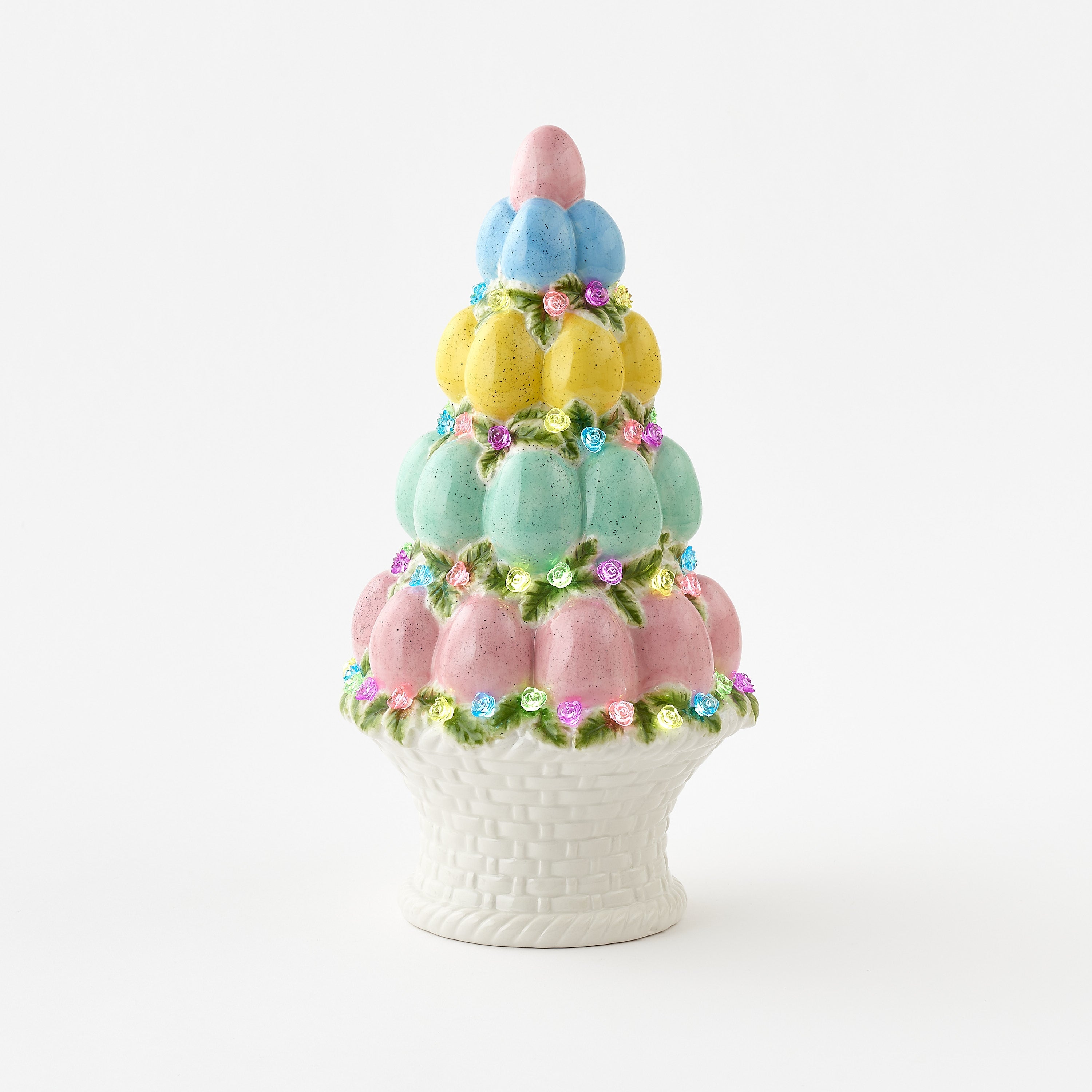 Decorative cake-shaped vase with pastel colors on a white background