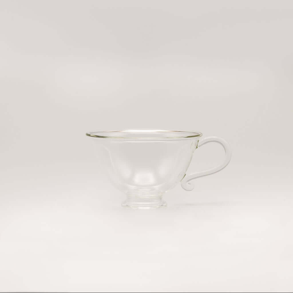 Petite Tasse, Clear (Set of 2) elegant glass teacup with curvy silhouette and handle.