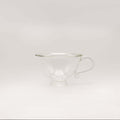Petite Tasse, Clear (Set of 2) elegant glass teacup with curvy silhouette and handle.