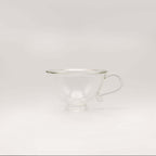 Petite Tasse, Clear (Set of 2) elegant glass teacup with curvy silhouette and handle.