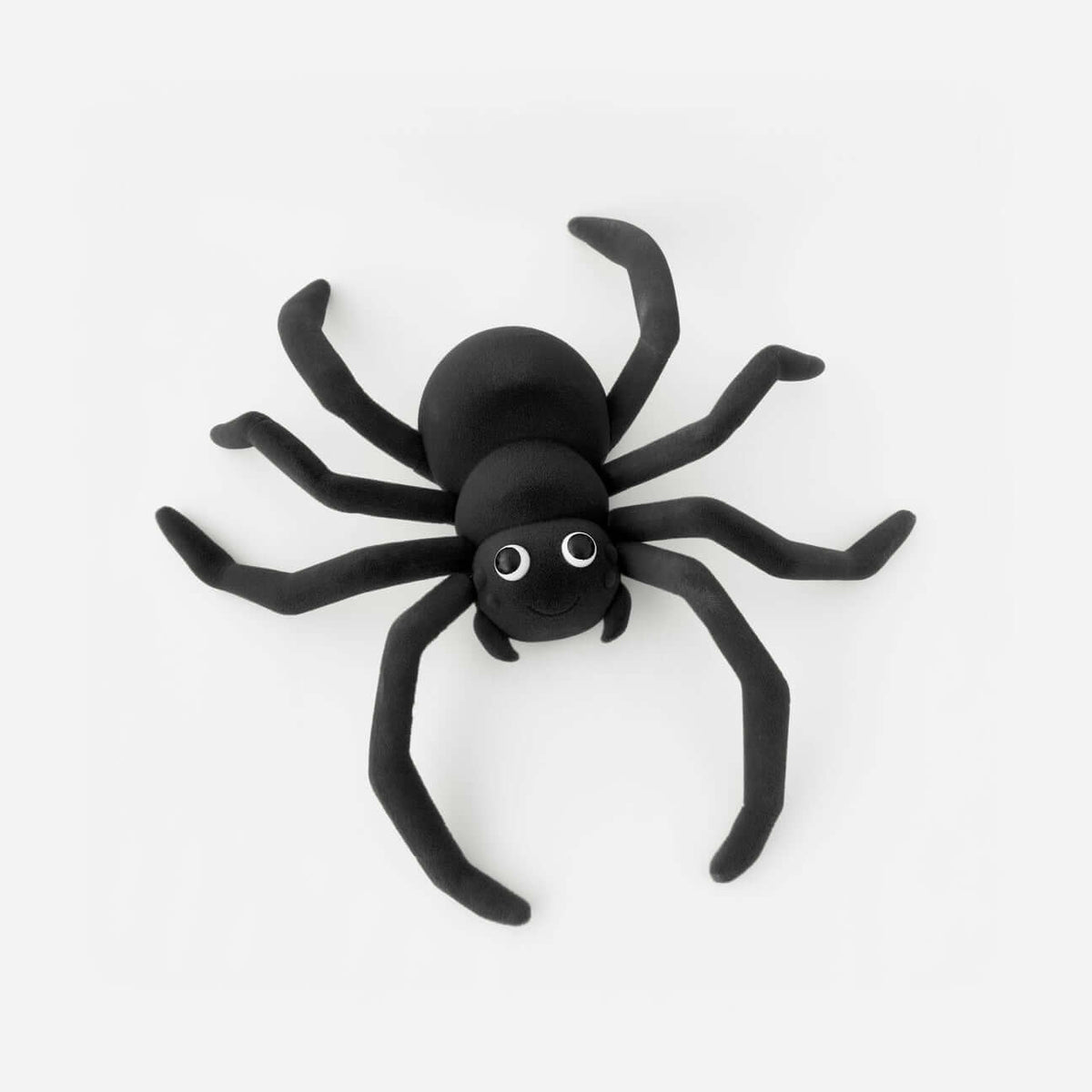 Flocked Giant Spider with googly eyes, soft velvety finish, and bendable legs, perfect for Halloween decor.