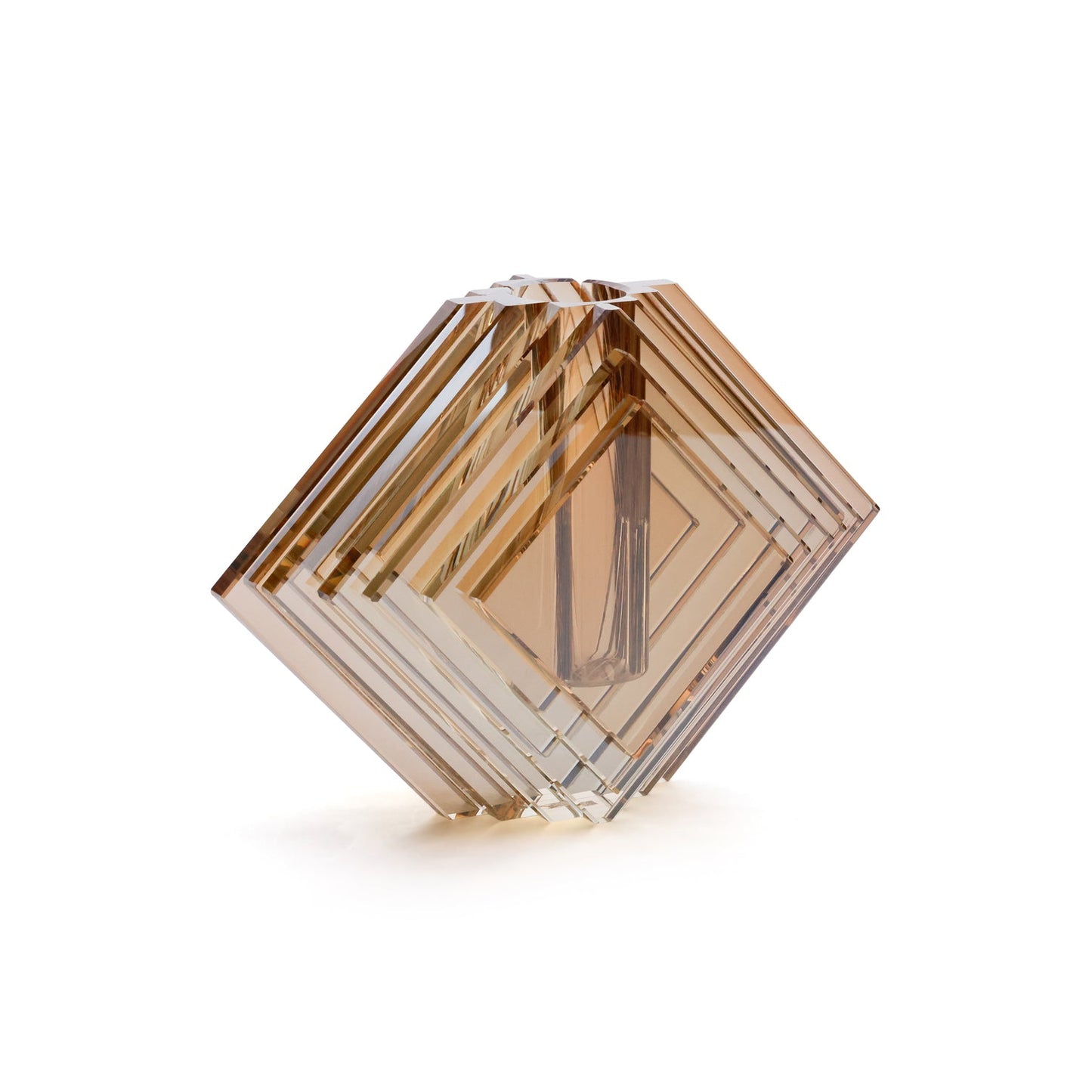 Hexagonal crystal with brown and clear colors on a white background