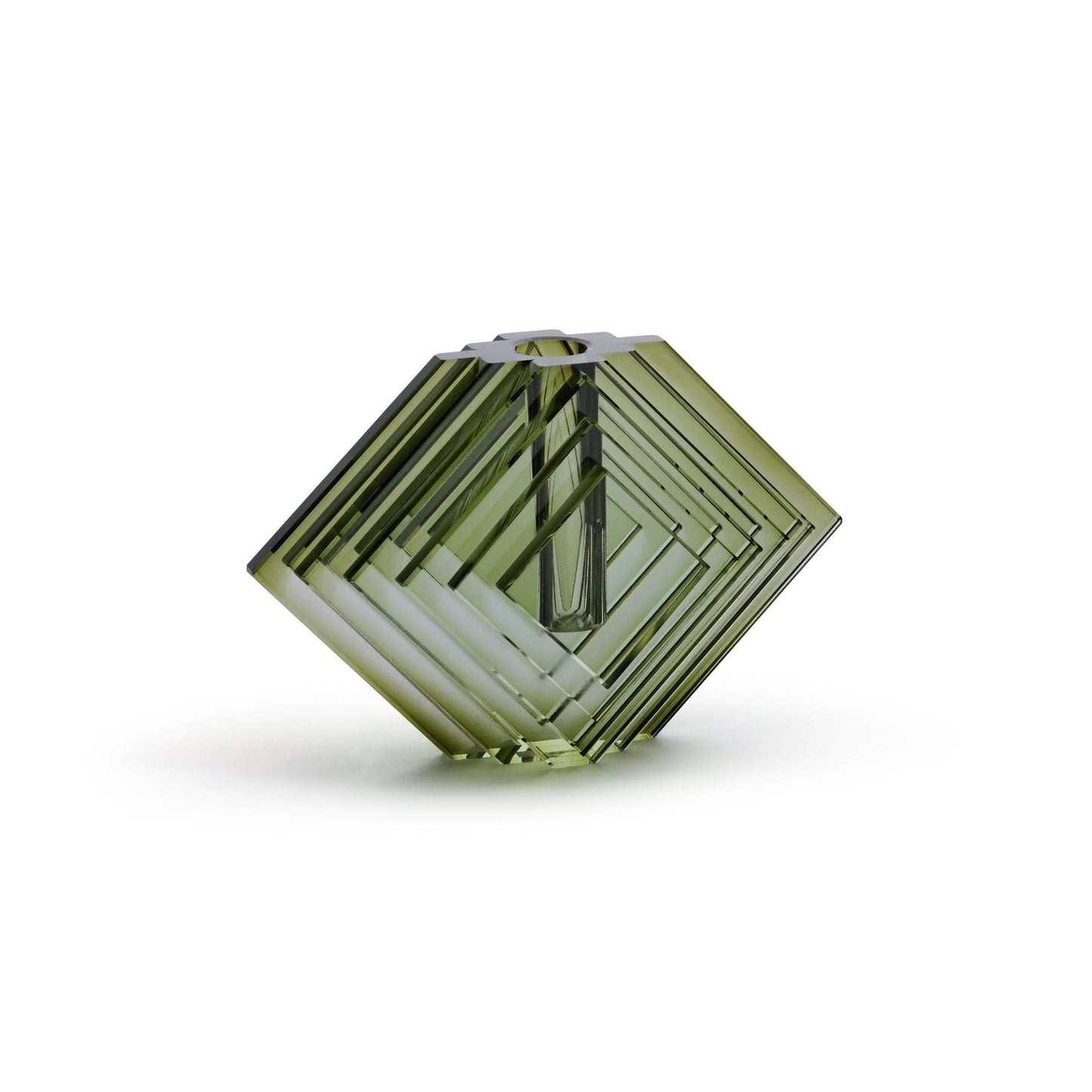 Green geometric crystal on a white background