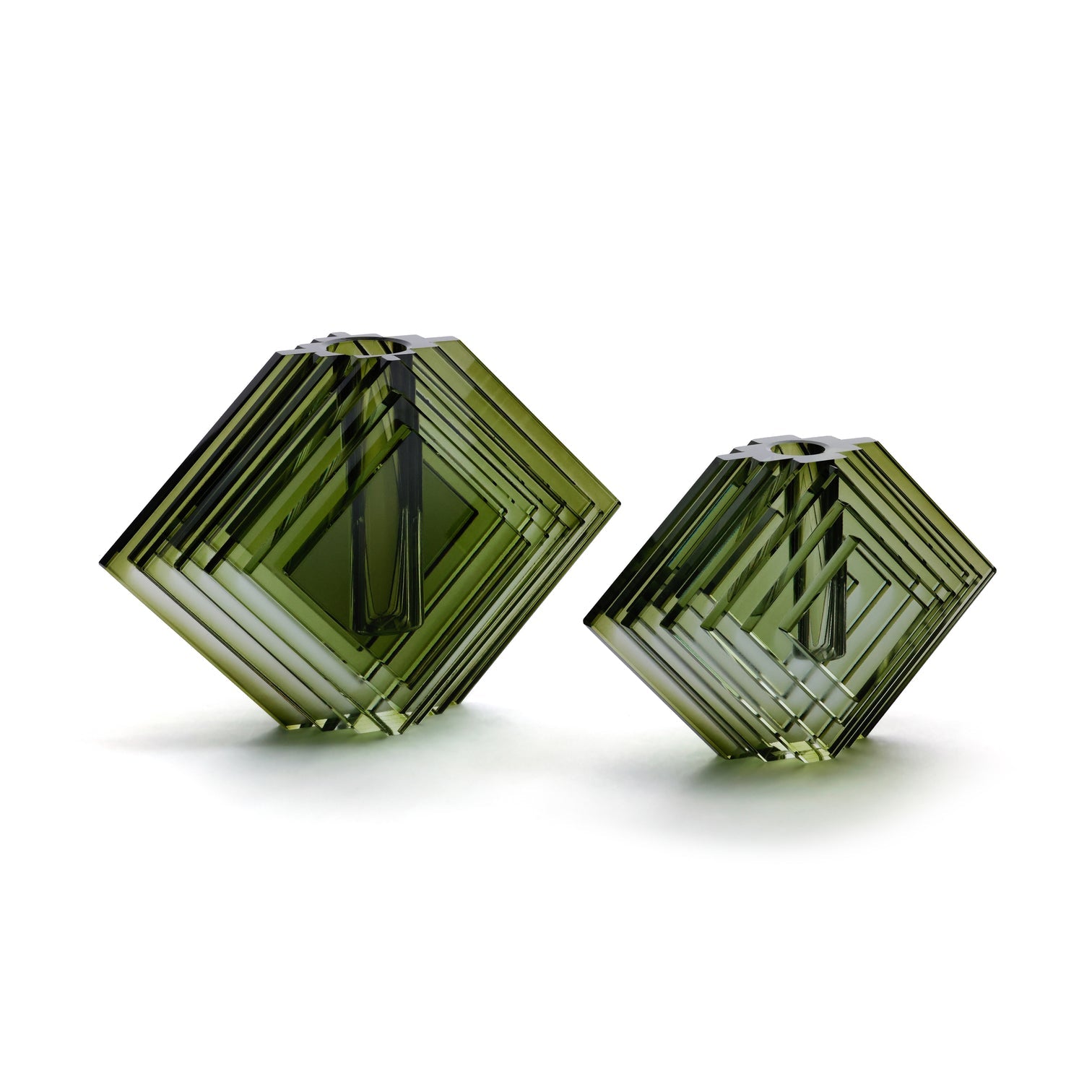 Two green geometric vases on a white background