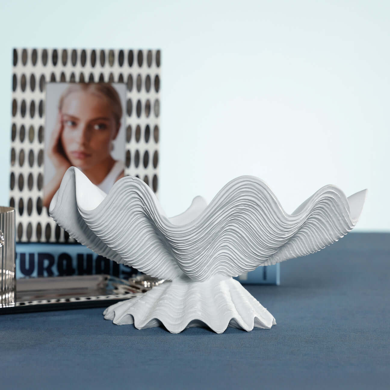Champagne Reef Resin Decorative Shell Bowl on a table, showcasing its textured and sculptural design.