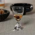 Timeless Sip Shot Glass (Set of 6) featuring a flared bowl and clear glass showcasing amber liquor.