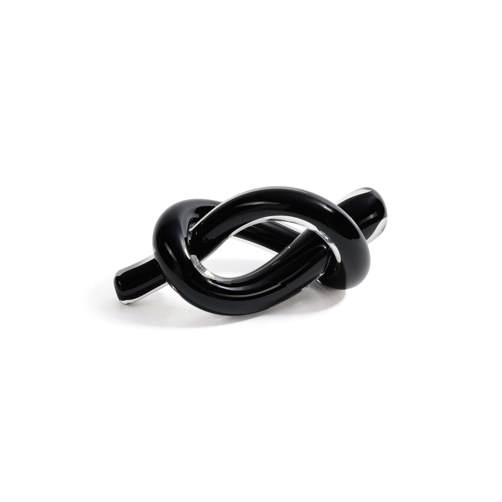 Obsidian Glass Knot Paperweight in sleek black glass, showcasing a modern knotted design for elegant decor.