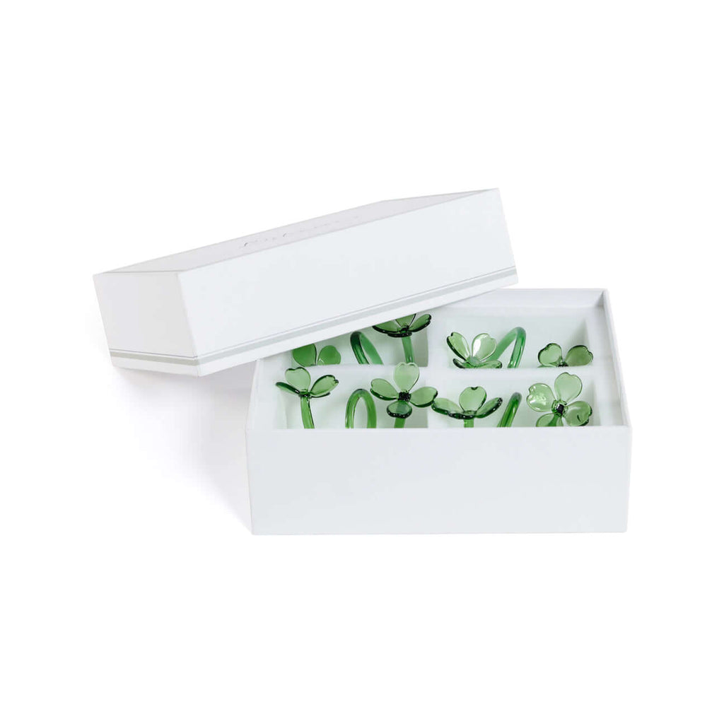 Four Botanica Glass Flower Napkin Rings - Boxed (Set of 4) in elegant white box with delicate green glass flowers.