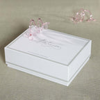 Four Botanica Glass Flower Napkin Rings - Boxed (Set of 4) showcased in elegant packaging with pink glass details.