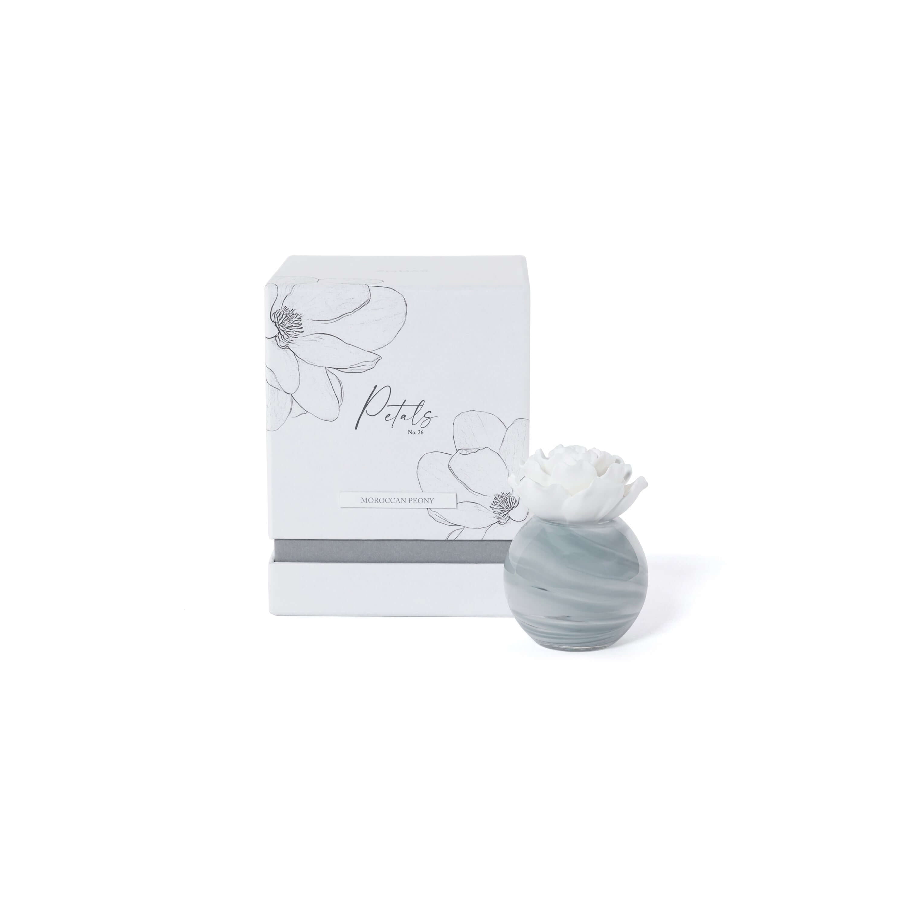 Petals Porcelain Diffuser - Small featuring Moroccan Peony scent and decorative porcelain flower on a marbled glass vessel.