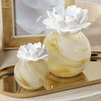 Petals Porcelain Diffuser - Small displayed with a marbled glass vessel and delicate porcelain flower.