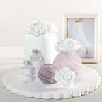 Petals Porcelain Diffuser - Small displayed with marbled glass and delicate porcelain flowers on a marble tray.