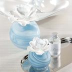 Petals Porcelain Diffuser - Small displayed with marbled blue glass and porcelain flower on a silver tray.
