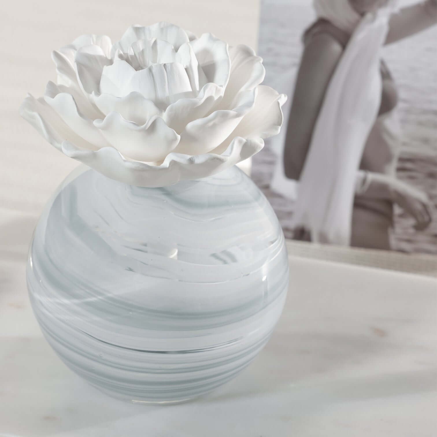 Petals Porcelain Diffuser - Large with delicate porcelain flower and marbled glass vessel.