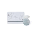 Petals Porcelain Diffuser - Large with marbled glass vessel and porcelain flower on display.